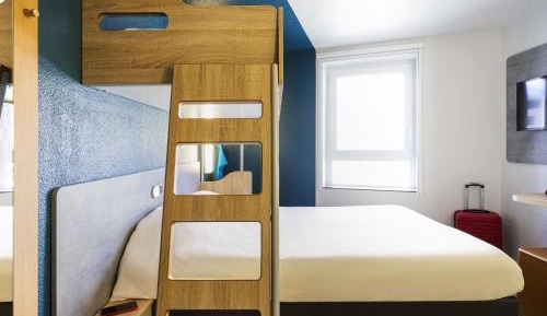 Room with One Queen Bed and One Bunk Bed